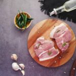 sliced meat on brown wooden chopping board