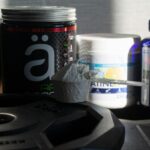 a table topped with bottles of vitamins and pills