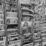 Magazines and newspapers displayed on a rack