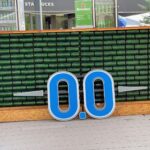 blue and white signage on brown brick wall