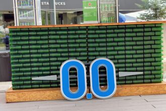 blue and white signage on brown brick wall