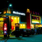 cars parked in front of UNKs restaurant during night time