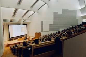 people sitting on chair in front of computer
