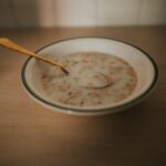 a bowl of cereal with a spoon in it