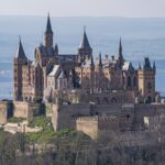 a castle on a hill with Hohenzollern Castle in the background