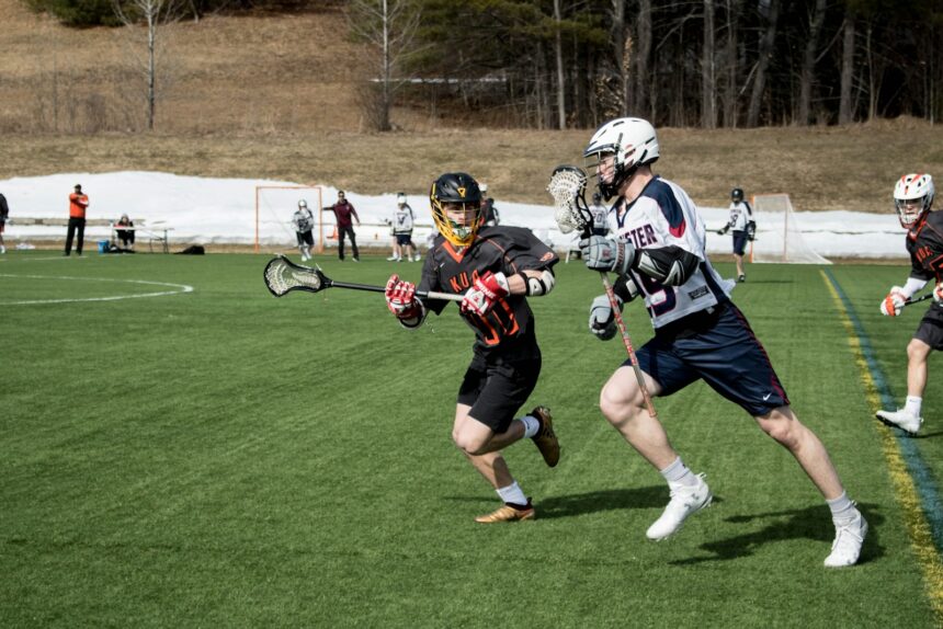 lacrosse players on sports field