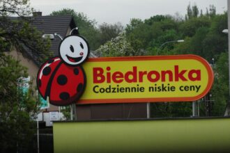 a sign with a ladybug painted on it