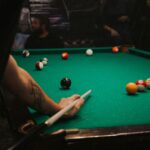 man playing pool