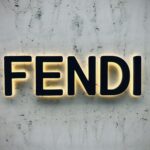 the word fendi spelled with neon lights on a wall