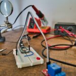 white and blue electronic console with black multitester